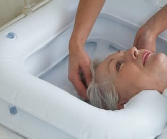 How to wash hair in bed for bedridden senior without making a mess