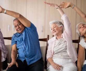 Doing pilates movements while seated helps seniors get the health benefits of pilates without needing to lie down to exercise